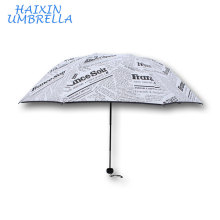 Anti-UV Mujeres Plegables Impreso Sun-Rain Gear Negro Newsprint Precio competitivo Logo Impreso UV resistente Mini Sun Paraguas